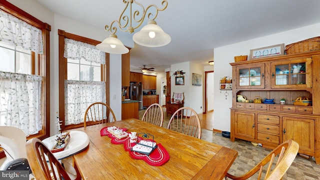 dining space featuring ceiling fan