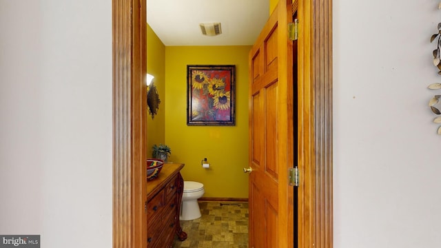 bathroom with vanity and toilet