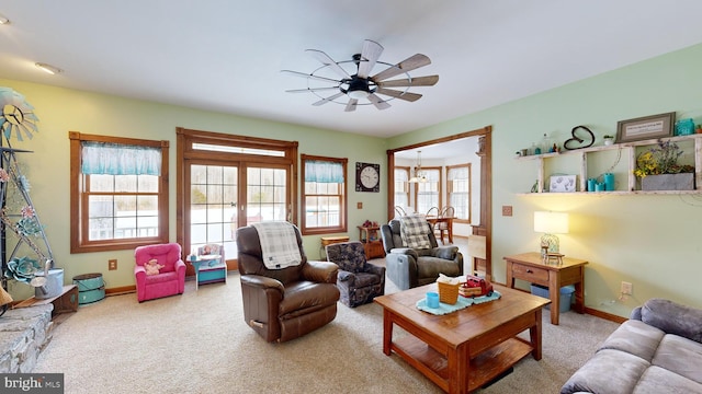 living room featuring ceiling fan and carpet