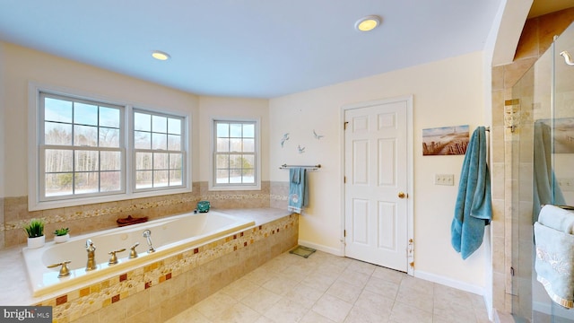 bathroom with tile patterned floors and plus walk in shower