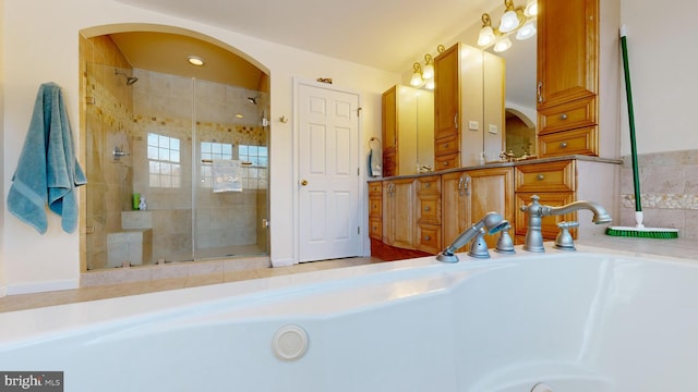 bathroom with a tile shower