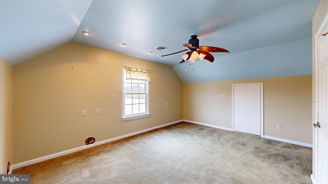 bonus room with carpet floors, vaulted ceiling, and ceiling fan