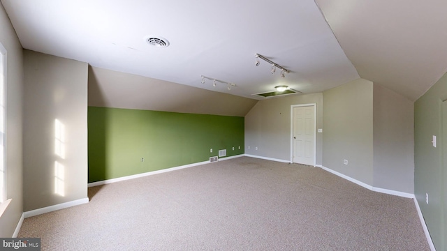 bonus room featuring lofted ceiling and carpet