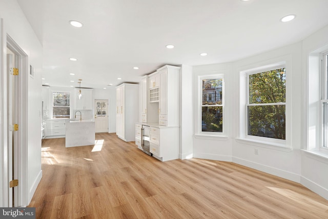 unfurnished living room with light hardwood / wood-style floors