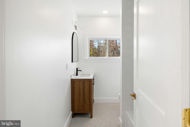 bathroom with tile patterned flooring and vanity