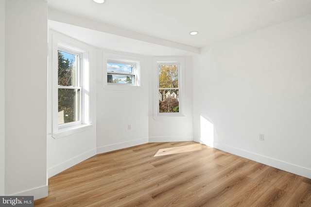 spare room with light hardwood / wood-style flooring