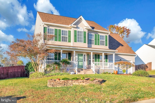 colonial house with a porch and a front yard