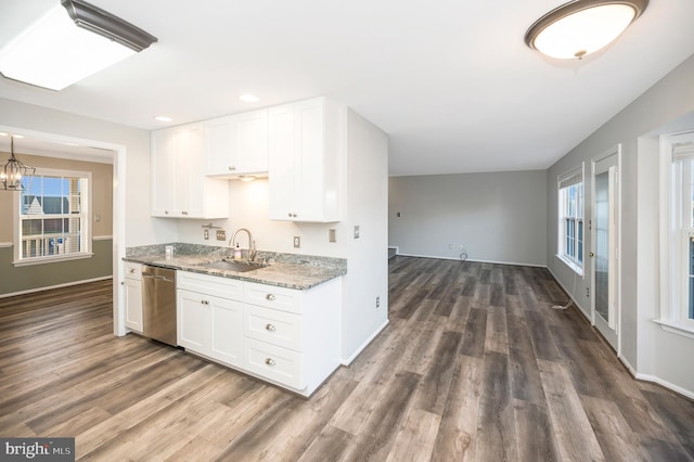 kitchen featuring dark hardwood / wood-style flooring, light stone countertops, sink, white cabinets, and stainless steel dishwasher