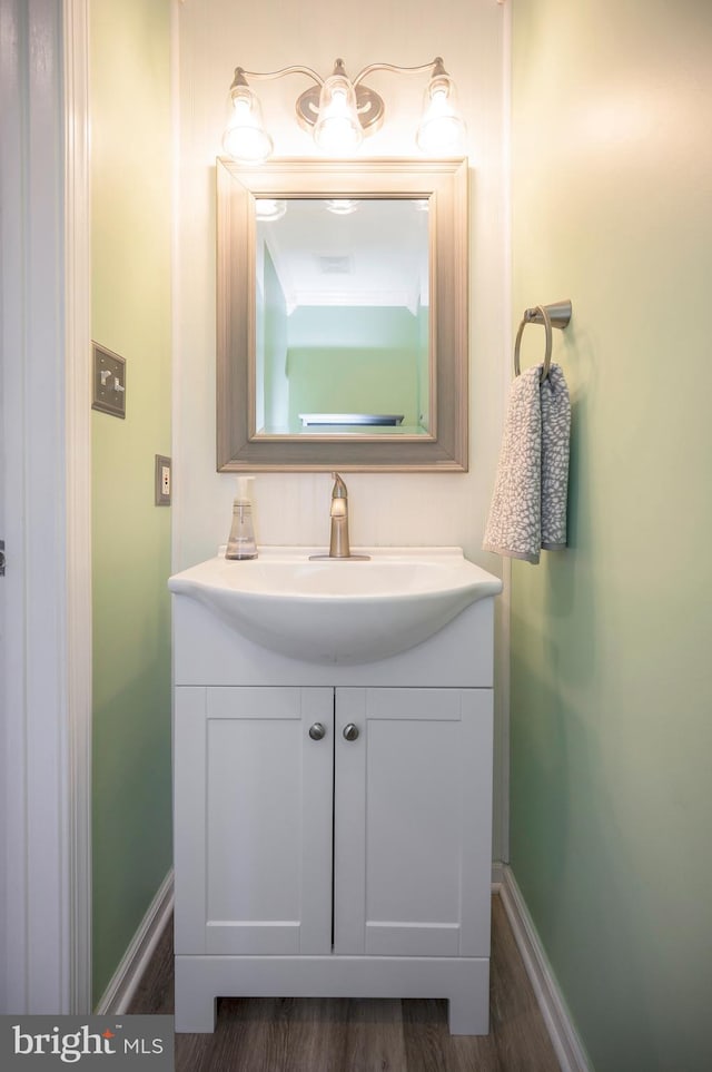 bathroom featuring vanity and hardwood / wood-style flooring