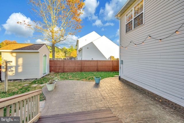 exterior space with a shed and a patio area