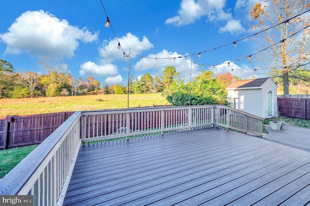 wooden terrace with a storage unit