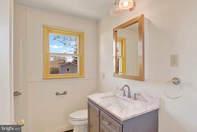 bathroom with toilet and vanity