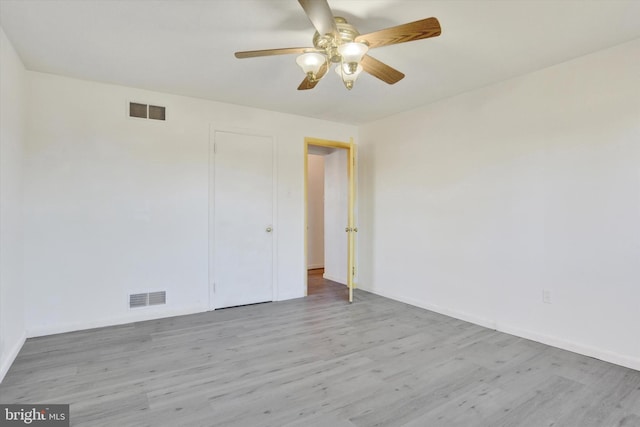 unfurnished room with ceiling fan and light wood-type flooring