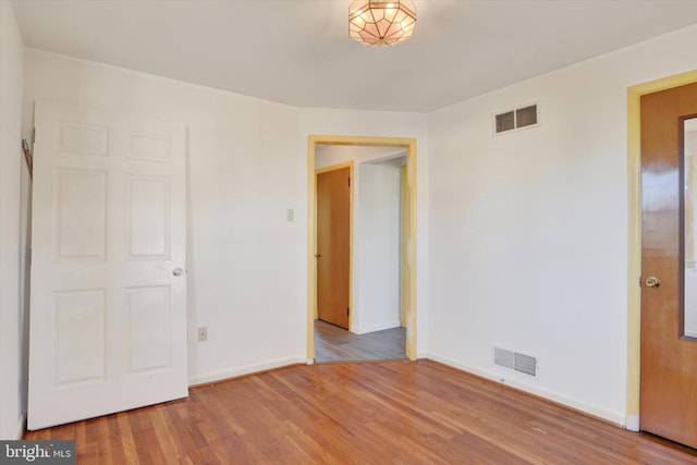 unfurnished bedroom featuring light wood-type flooring