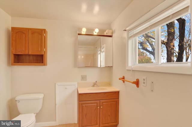 bathroom featuring toilet and vanity