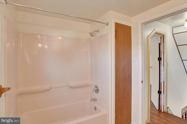 bathroom featuring shower / tub combination and hardwood / wood-style floors