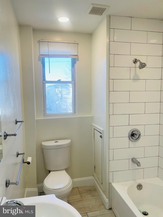 1525 W Wyoming Ave, Philadelphia, PA 19140 - full bath with toilet, baseboards, and  shower combination