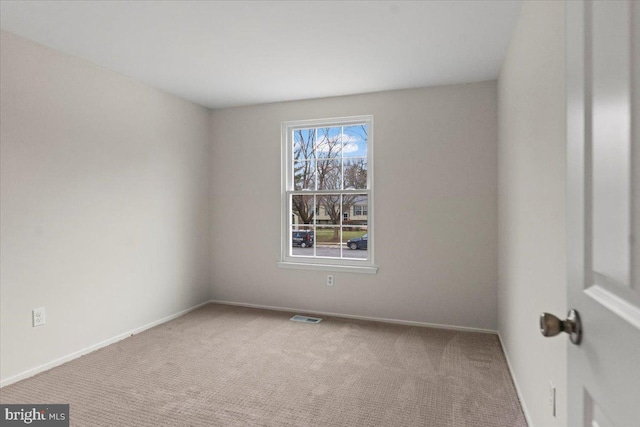 unfurnished room featuring carpet floors