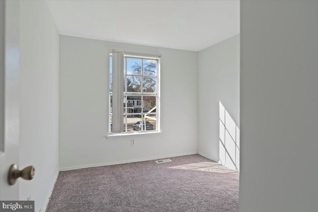 empty room featuring carpet floors