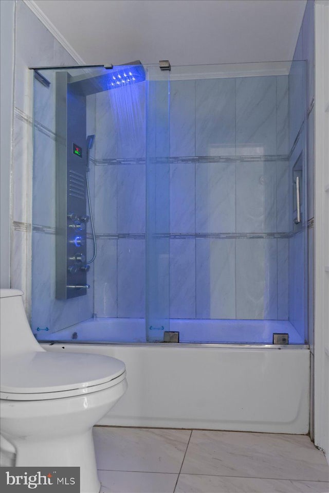 bathroom with enclosed tub / shower combo and toilet