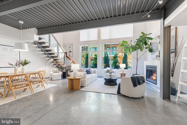 living room with concrete flooring