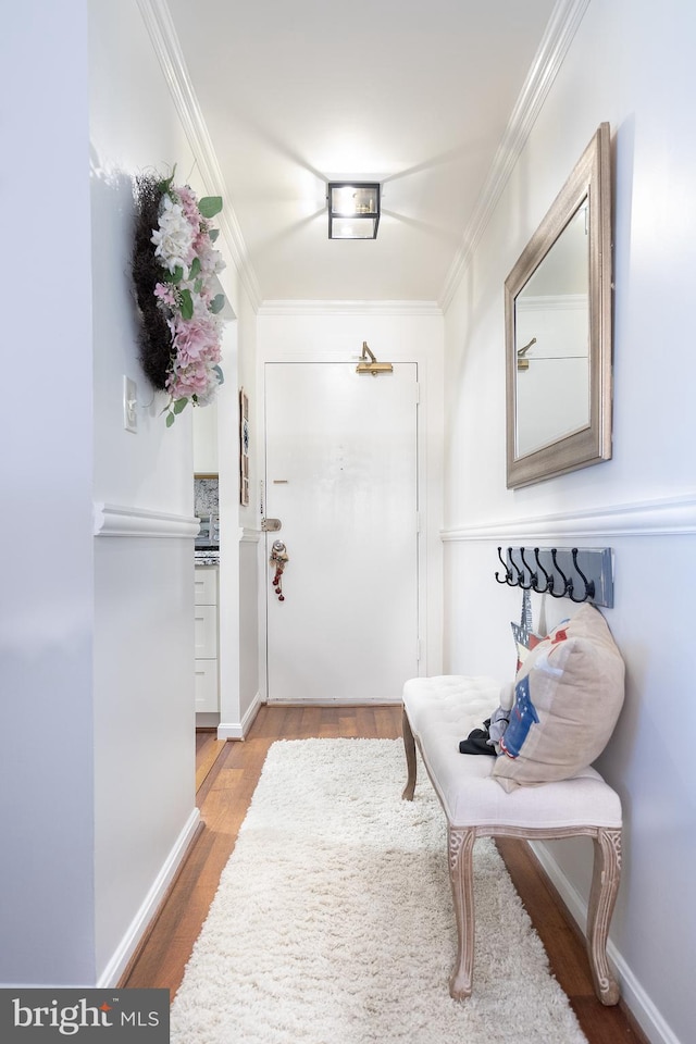 interior space with light hardwood / wood-style flooring and ornamental molding