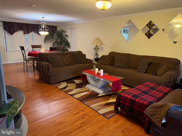 living room featuring crown molding and light hardwood / wood-style flooring