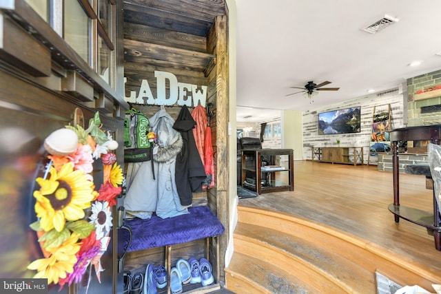 interior space with hardwood / wood-style floors and ceiling fan