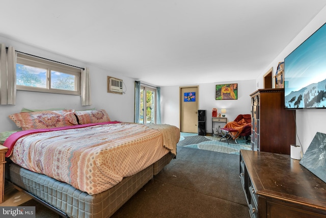 carpeted bedroom featuring a wall mounted AC