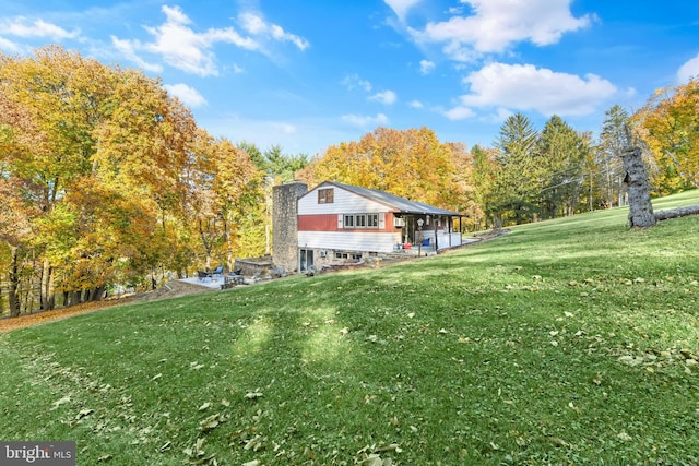316 Spring Valley Rd, Reading, PA 19605 - view of home's exterior featuring a lawn and a chimney