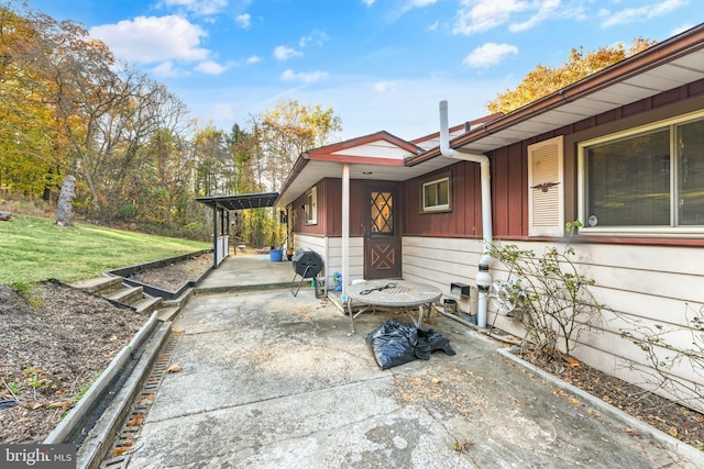 view of side of property featuring a patio area