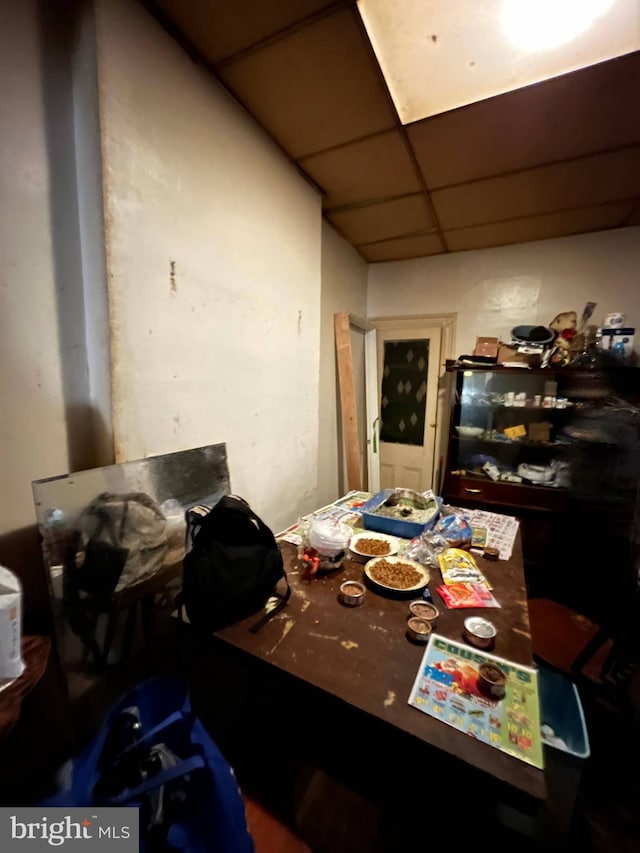 dining area with a drop ceiling