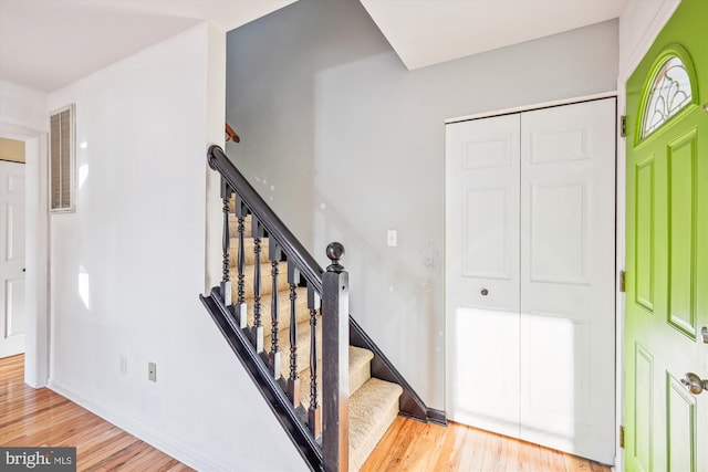 staircase featuring hardwood / wood-style flooring