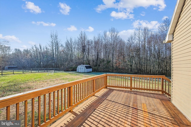 deck with a lawn and a storage unit