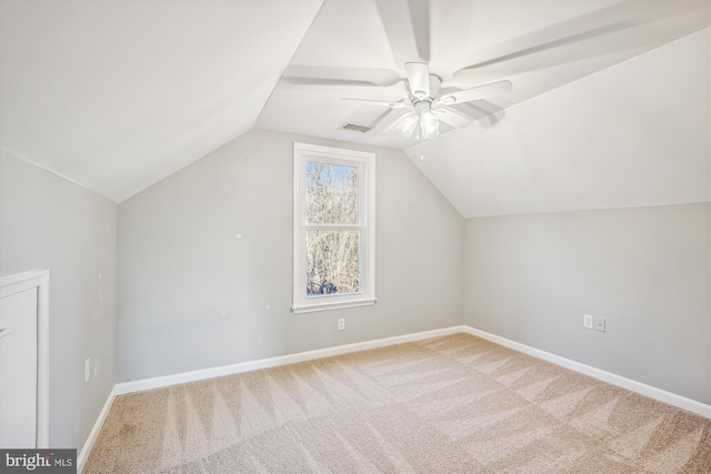 additional living space featuring carpet flooring, ceiling fan, and vaulted ceiling