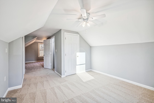 bonus room featuring light carpet, ceiling fan, and lofted ceiling