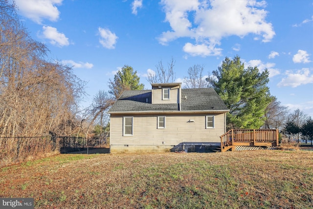 view of home's exterior with a yard and a deck