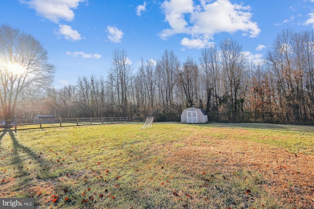 view of yard featuring a storage unit and a rural view