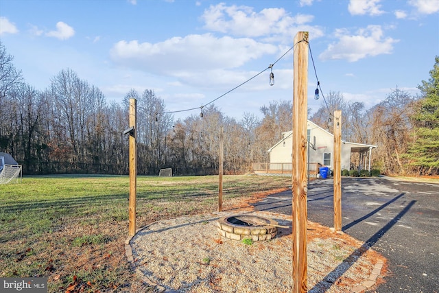 view of yard with an outdoor fire pit