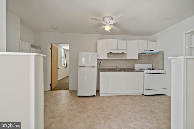 kitchen featuring decorative backsplash, white appliances, ceiling fan, sink, and white cabinetry