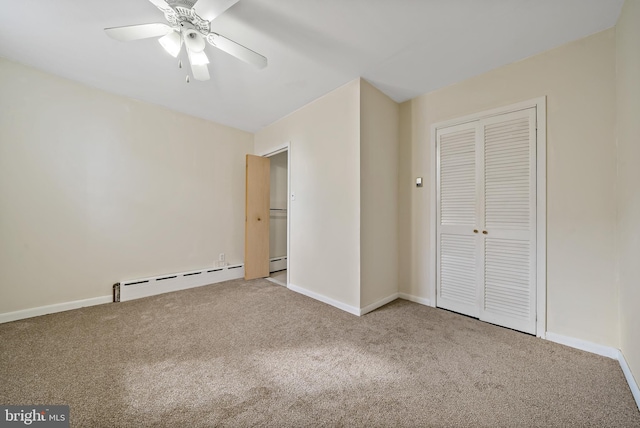 unfurnished bedroom featuring ceiling fan, baseboard heating, light carpet, and a closet