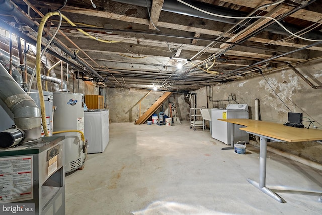 basement with washer and clothes dryer and gas water heater