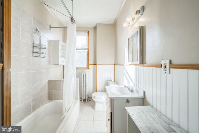 full bathroom featuring tile patterned floors, shower / bathtub combination with curtain, vanity, and toilet