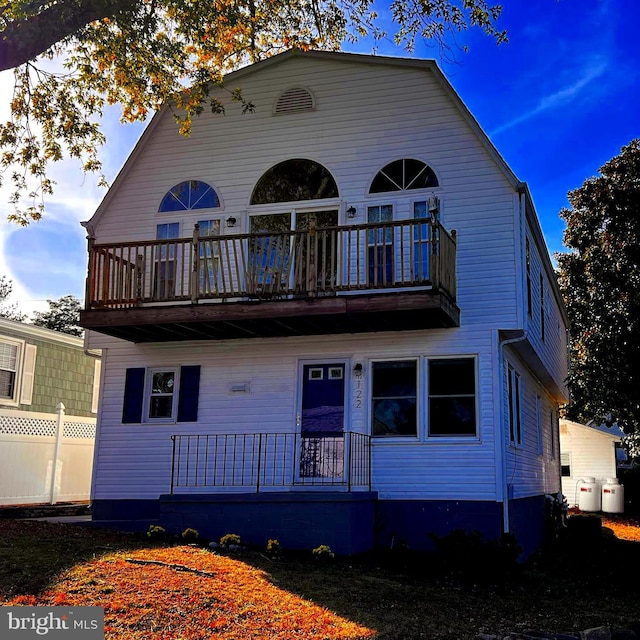 view of front of property with a balcony