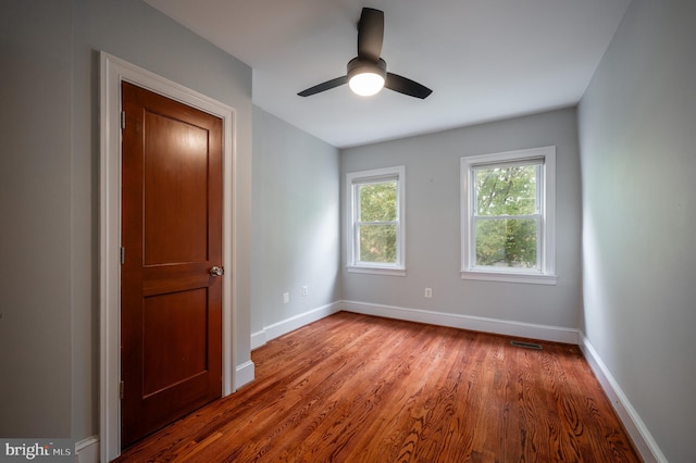 spare room featuring ceiling fan and light wood-type flooring