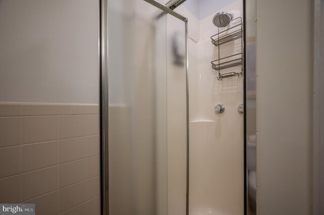 room details featuring a shower with shower door