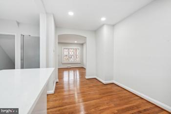 corridor with light wood-type flooring