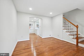 spare room featuring hardwood / wood-style floors