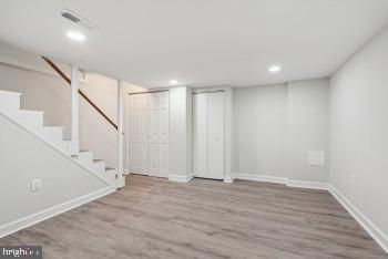 basement featuring hardwood / wood-style floors