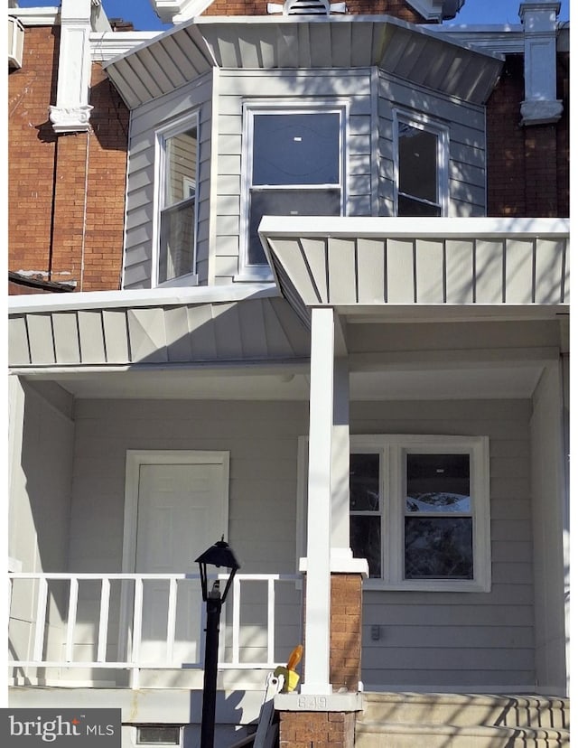 doorway to property featuring a porch